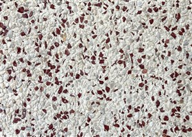 Ivory-toned Pebblewash surface with mini beige and scarlet stone aggregates, perfect for elegant outdoor flooring