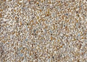 Exposed aggregate plaster in perlato shade Perlato-style Pebblewash featuring mini buff stone textures for a sophisticated neutral flooring option