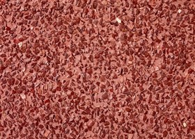 Exposed wall finish in red colour with red grains